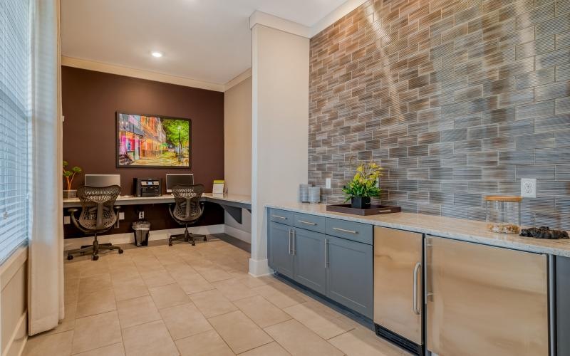 a kitchen with a bar and chairs