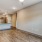 a room with a ceiling fan and a wood floor