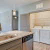 a kitchen with a laundry closet