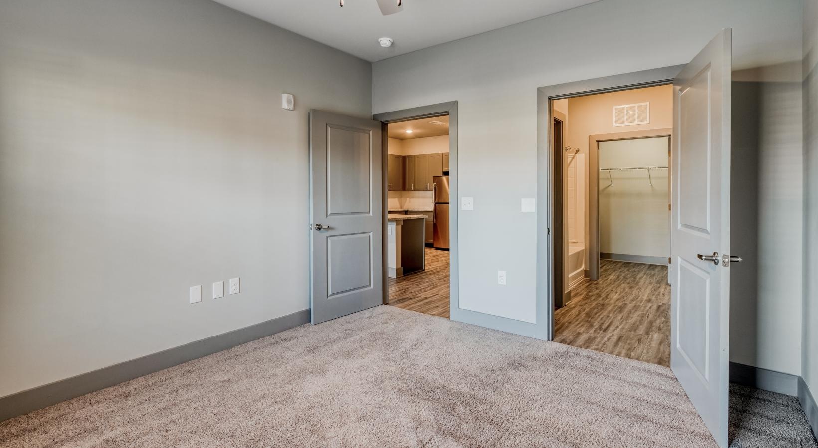 The essence of exceptional living a room with a carpet and a ceiling fan