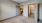 a room with a carpet and a ceiling fan