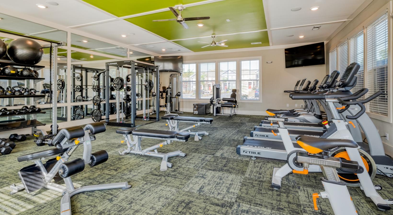 Quick access to state-of-the-art amenities a room with exercise equipment