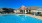 a swimming pool in front of a house