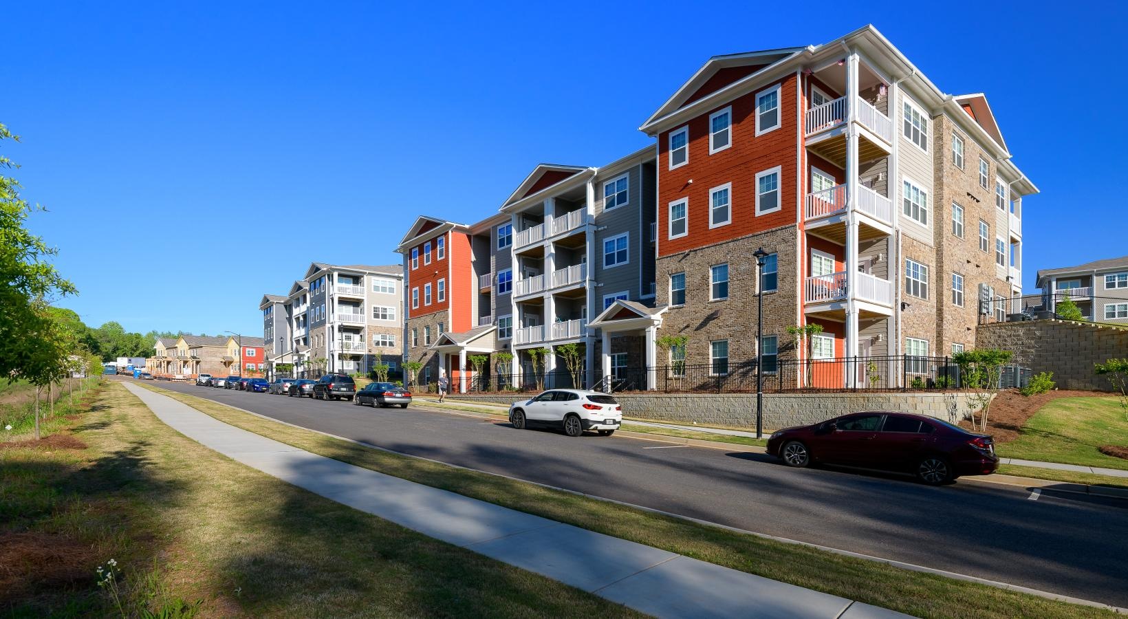 Settle into comfort at Ascent Athens a street with cars and buildings along it