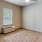 a room with a fan and a window