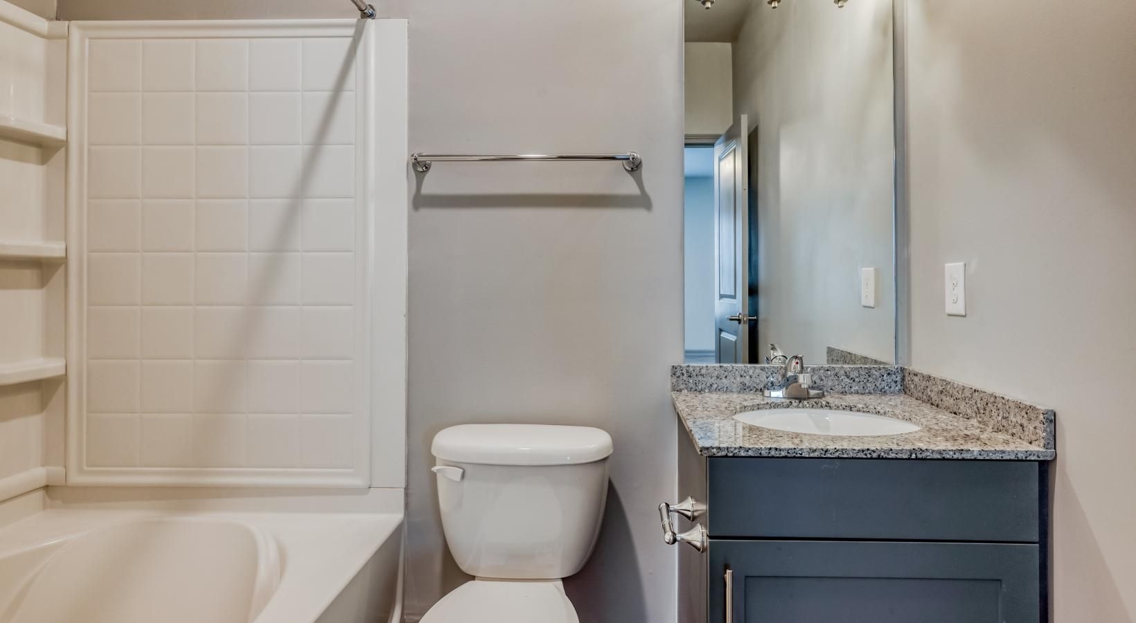 Spacious bathrooms with everything you need a bathroom with a tub sink and toilet