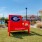 a red sign in a yard