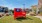 a red sign in a yard