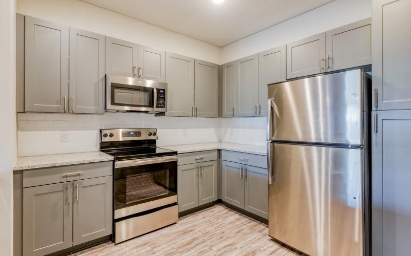 a kitchen with white cabinets