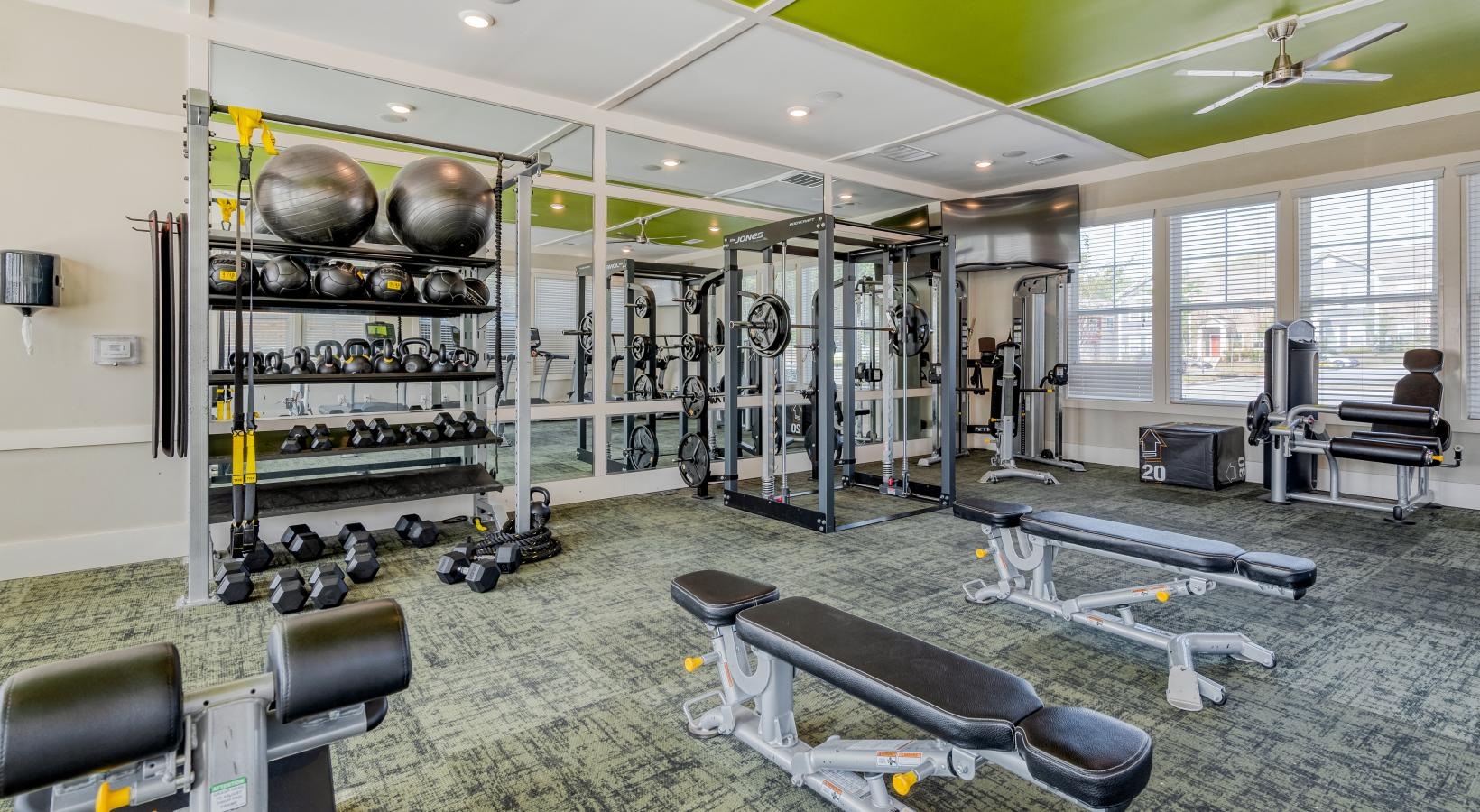 State-of-the-art amenities a gym with exercise equipment