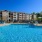 a swimming pool with a building in the background