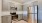 a kitchen with white cabinets