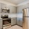 a kitchen with white cabinets