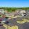a parking lot with cars and houses